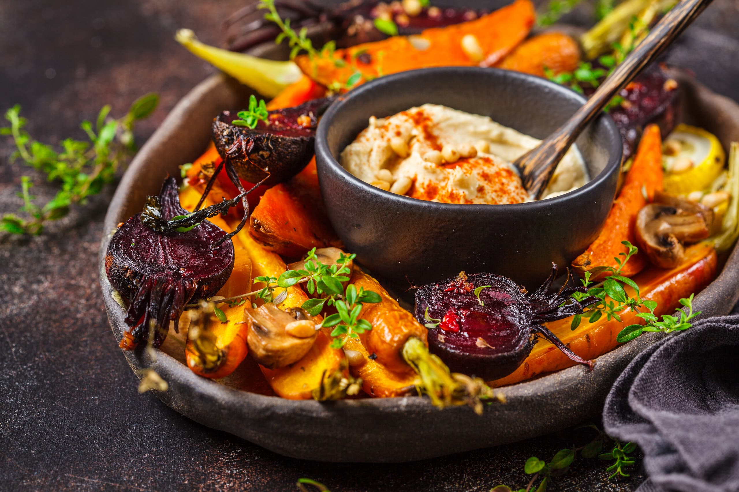 baked-vegetables-with-hummus-dark-dish (1)